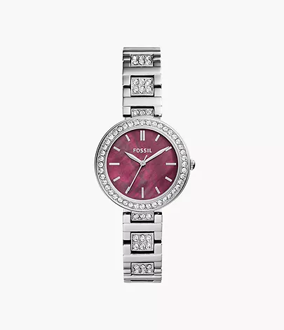 A silver women’s watch featuring a burgundy dial and glitz accents.