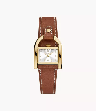 Une montre en cuir brun avec un cadran ton or pour femmes. 