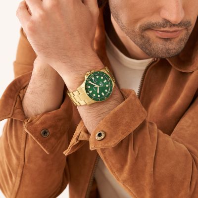 Reloj Fossil Blue de acero inoxidable tono dorado con tres agujas y fecha