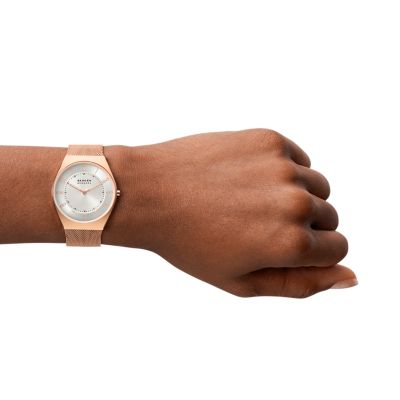 Rose gold watch shop on dark skin